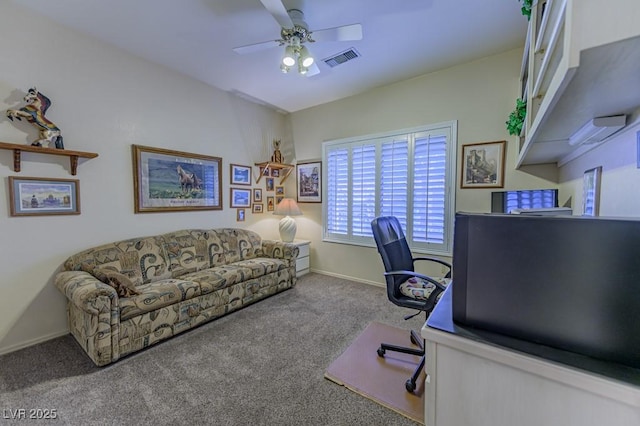 carpeted office space with a ceiling fan, visible vents, and baseboards