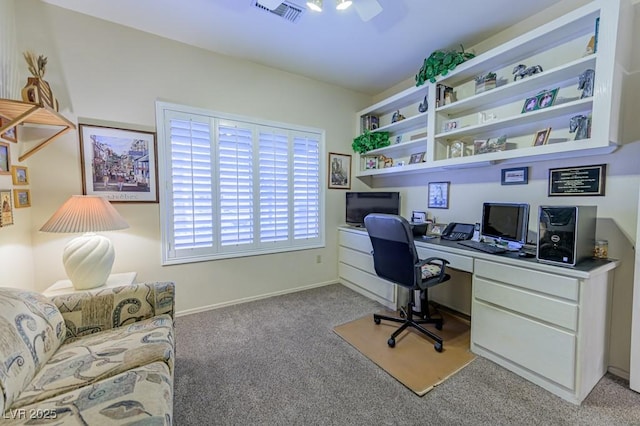 office area featuring light carpet, visible vents, and baseboards