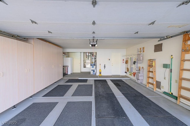 garage with a garage door opener and freestanding refrigerator