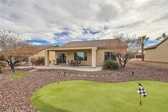 rear view of house featuring a patio area