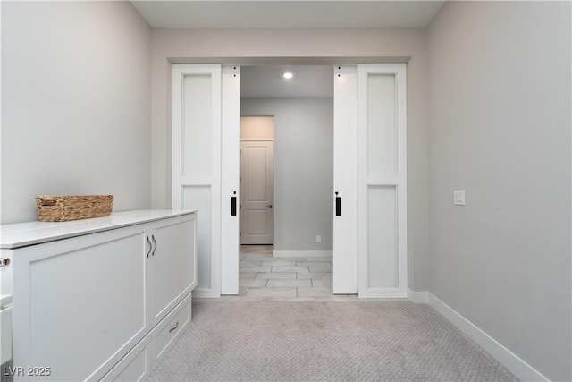 hallway with light carpet