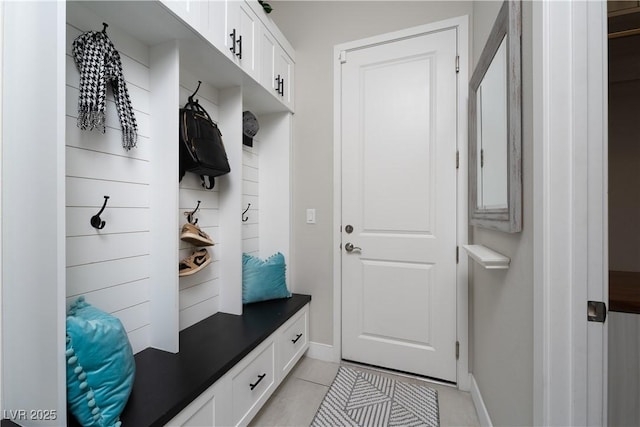 mudroom with light tile patterned flooring