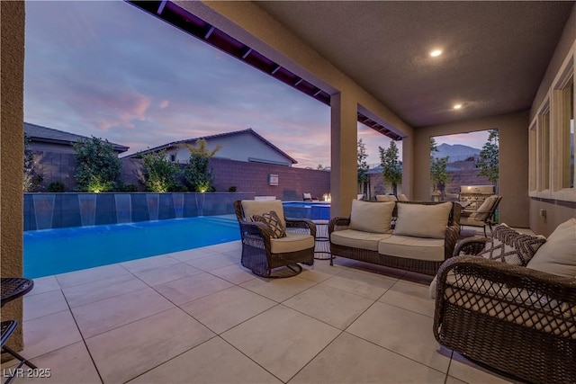 patio terrace at dusk with an outdoor hangout area