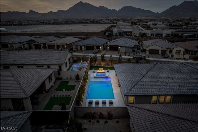 aerial view at dusk with a mountain view