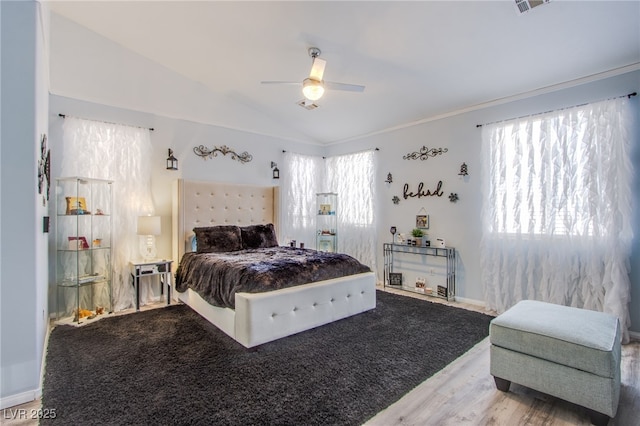 bedroom featuring vaulted ceiling, crown molding, and ceiling fan