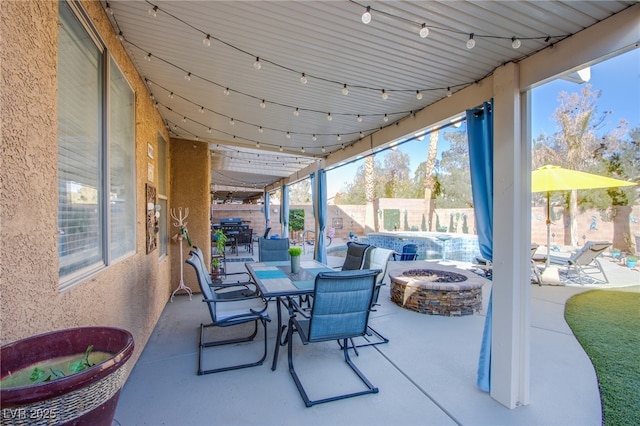 view of patio featuring a fire pit