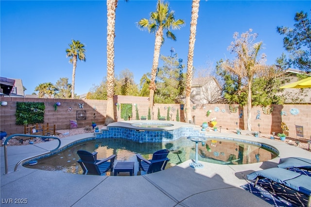 view of pool featuring a patio area and an in ground hot tub