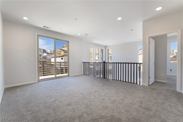 spare room featuring carpet floors