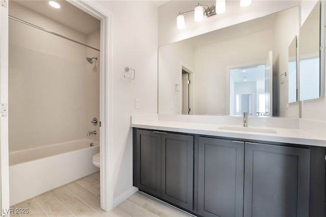 full bathroom with shower / bathing tub combination, vanity, and toilet