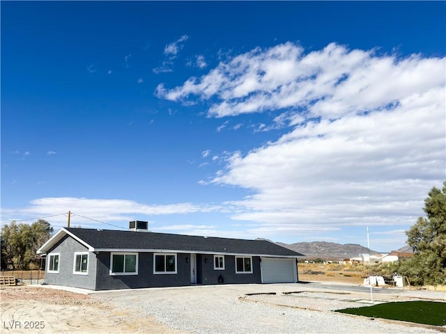 view of front of home featuring a garage and a mountain view