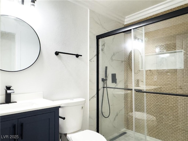 bathroom with vanity, an enclosed shower, crown molding, and toilet