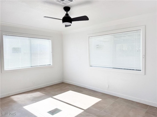 empty room featuring light tile patterned flooring, ceiling fan, and ornamental molding