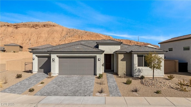 view of front of house with a garage and a mountain view