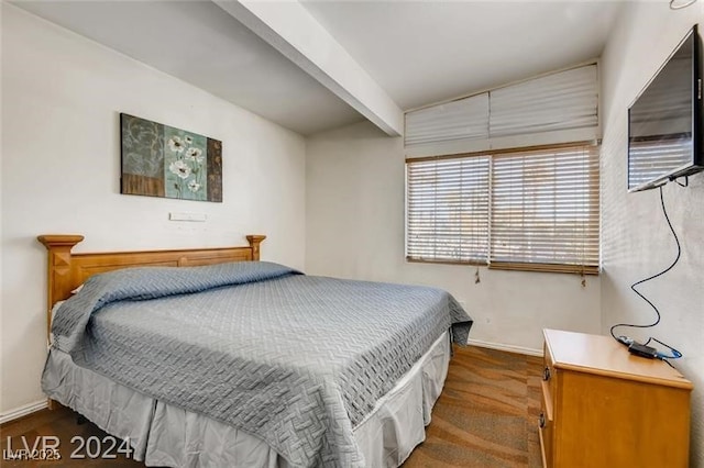 bedroom featuring beamed ceiling