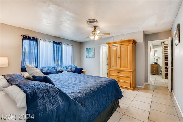 bedroom featuring light tile patterned flooring and ceiling fan