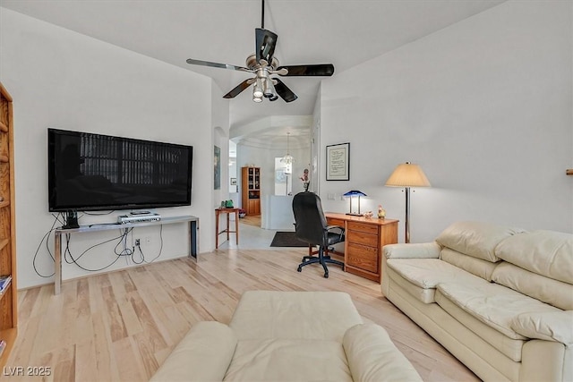 living room featuring ceiling fan and light wood-type flooring