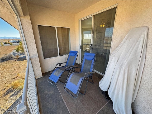 view of patio featuring a balcony