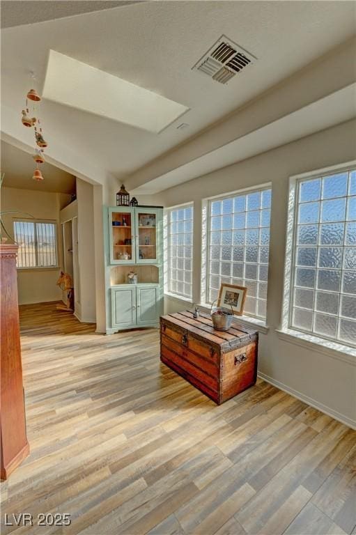 sitting room featuring light hardwood / wood-style flooring