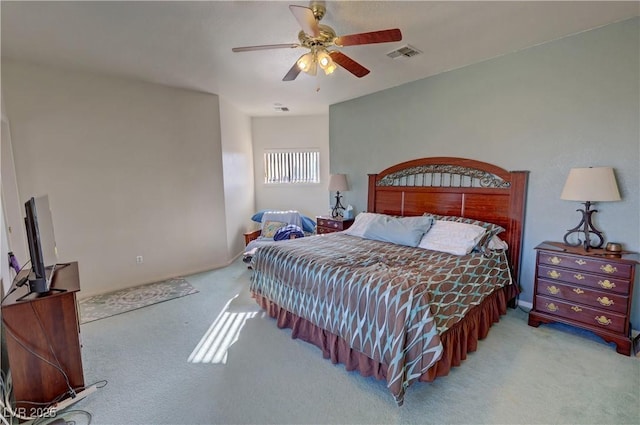 bedroom featuring light carpet and ceiling fan