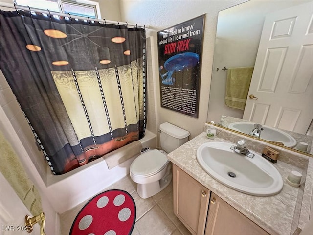 full bathroom featuring tile patterned floors, vanity, toilet, and shower / bath combo