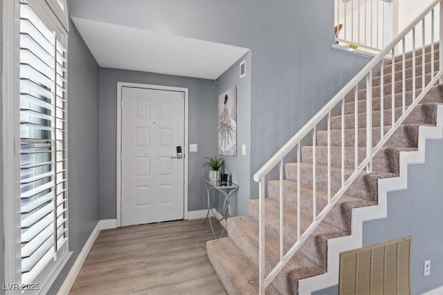 foyer with hardwood / wood-style flooring