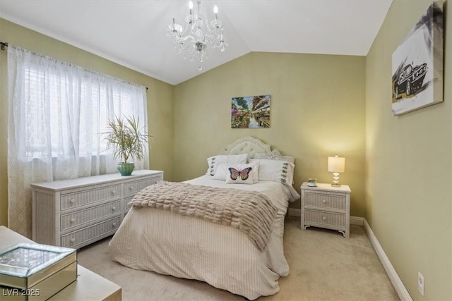 carpeted bedroom with lofted ceiling and an inviting chandelier