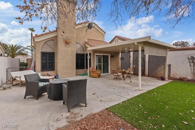 rear view of house with an outdoor living space and a patio