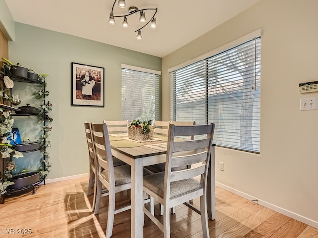 dining area featuring light wood-type flooring