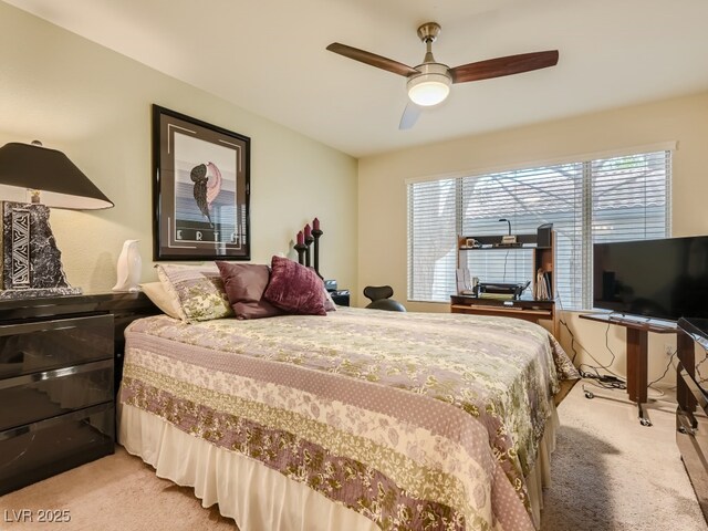 3055 Key Largo Dr Unit 203, Las Vegas, NV 89120 - bedroom with light carpet, ceiling fan, and a desk