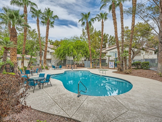 view of swimming pool with a patio