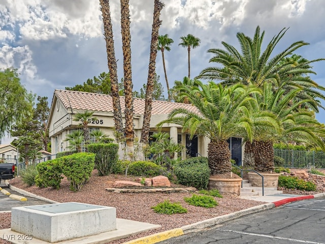 3055 Key Largo Dr Unit 203, Las Vegas, NV 89120 - view of front of house featuring stucco siding and a tile roof