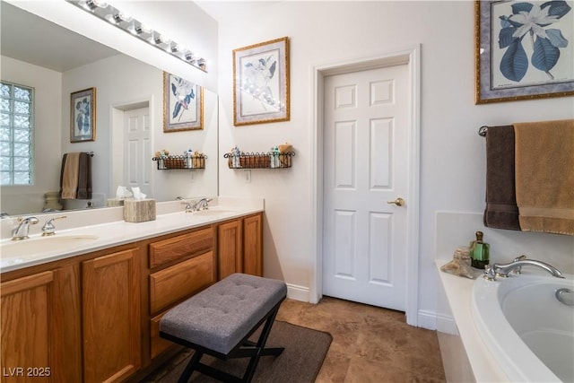 bathroom featuring double vanity, a garden tub, tile patterned flooring, and a sink