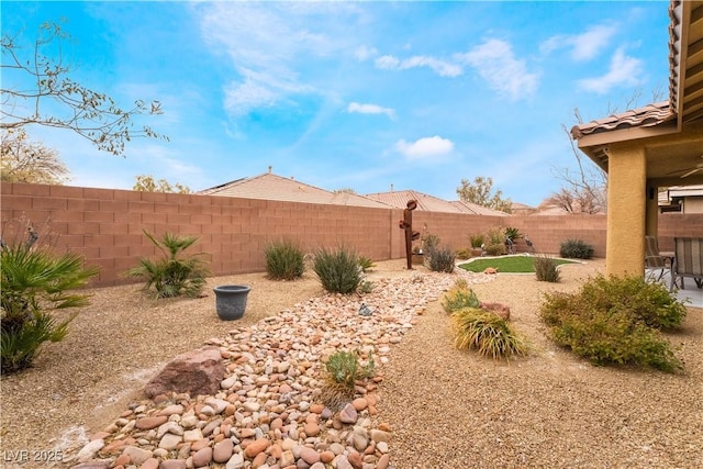 view of yard with a patio area and a fenced backyard