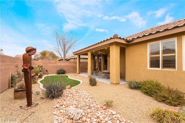 view of yard with a fenced backyard and a patio