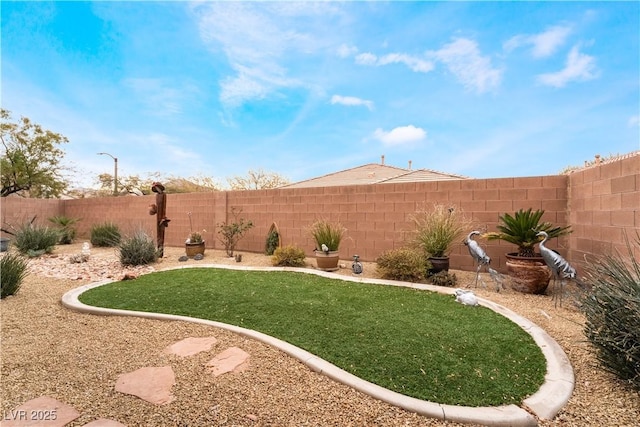 view of yard featuring a fenced backyard