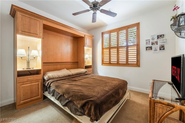 carpeted bedroom with baseboards and ensuite bathroom