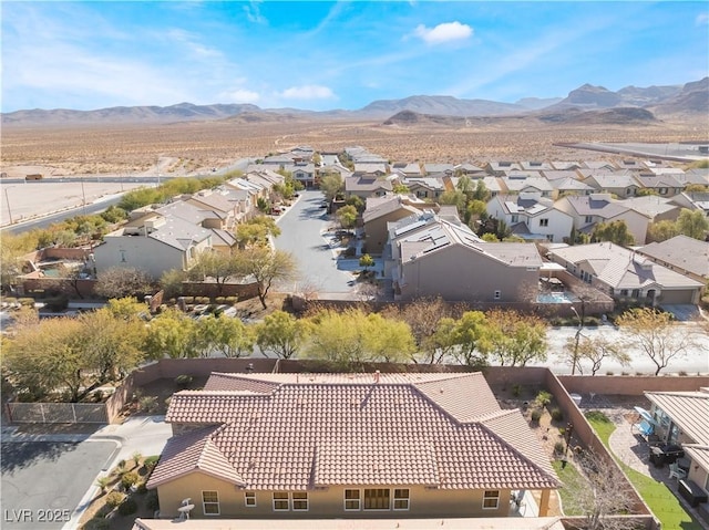 drone / aerial view with a residential view and a mountain view