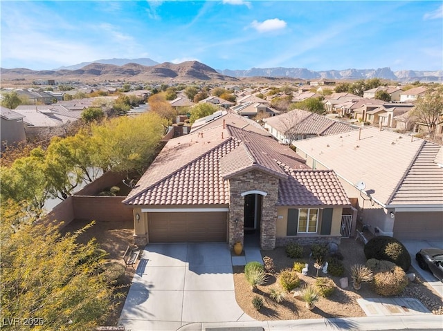 birds eye view of property featuring a residential view and a mountain view