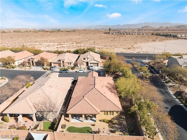 bird's eye view featuring a residential view and a mountain view