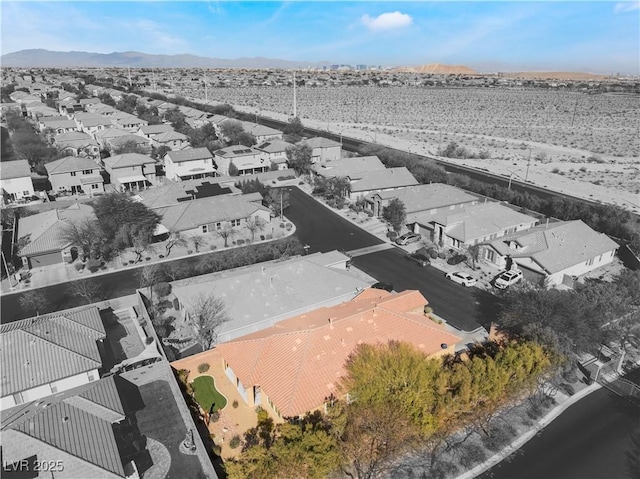 bird's eye view with a residential view and a mountain view