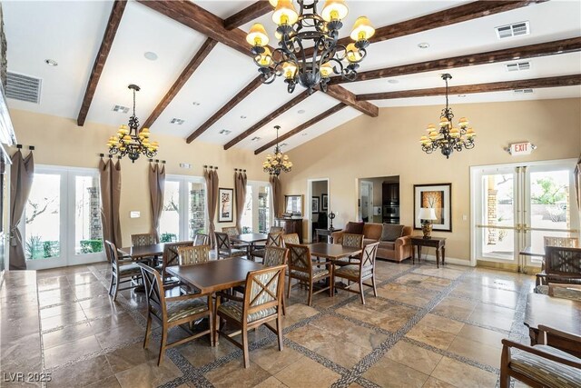 dining space with high vaulted ceiling, french doors, visible vents, and an inviting chandelier