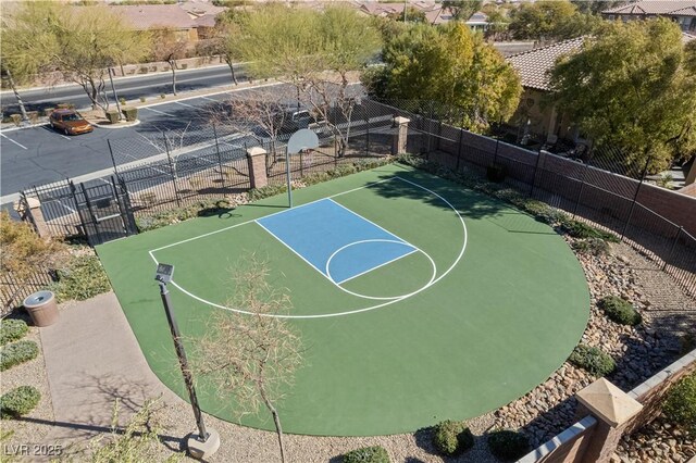 view of basketball court featuring community basketball court and fence