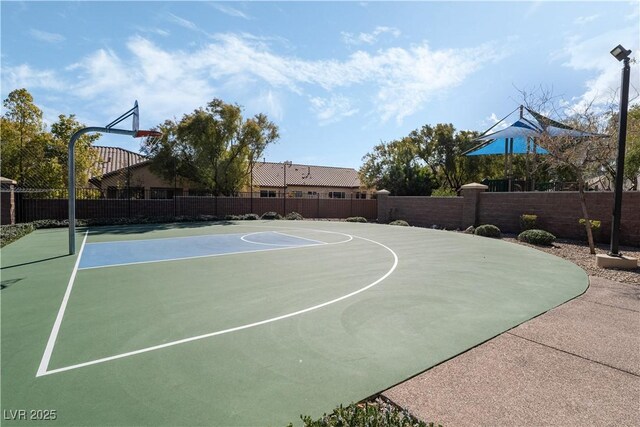 view of sport court featuring community basketball court and fence