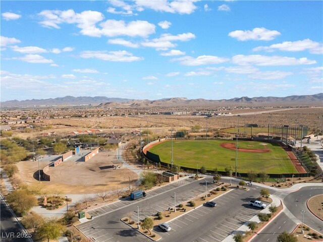 birds eye view of property with a mountain view