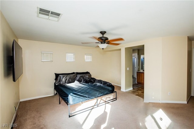 carpeted bedroom with ceiling fan