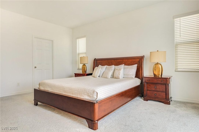 bedroom featuring light colored carpet