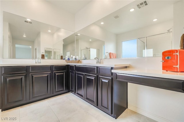 bathroom with vanity and tile patterned flooring