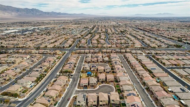 birds eye view of property featuring a mountain view