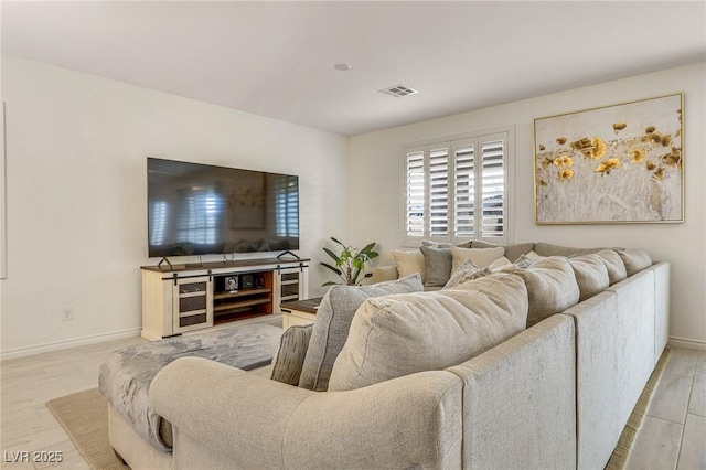 living room with light hardwood / wood-style flooring