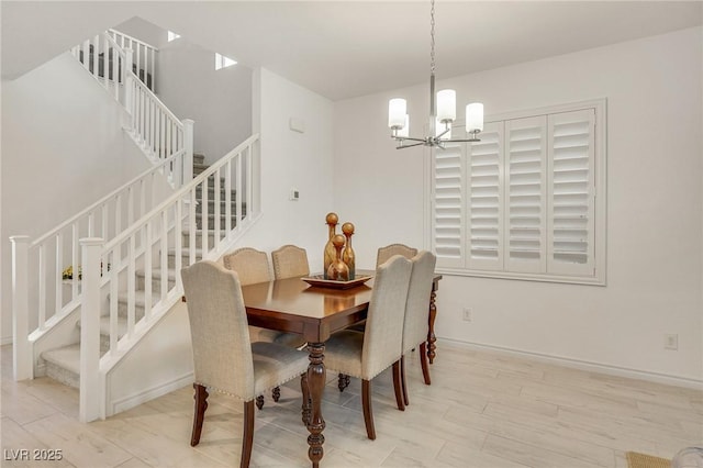 dining room with an inviting chandelier and light wood-type flooring